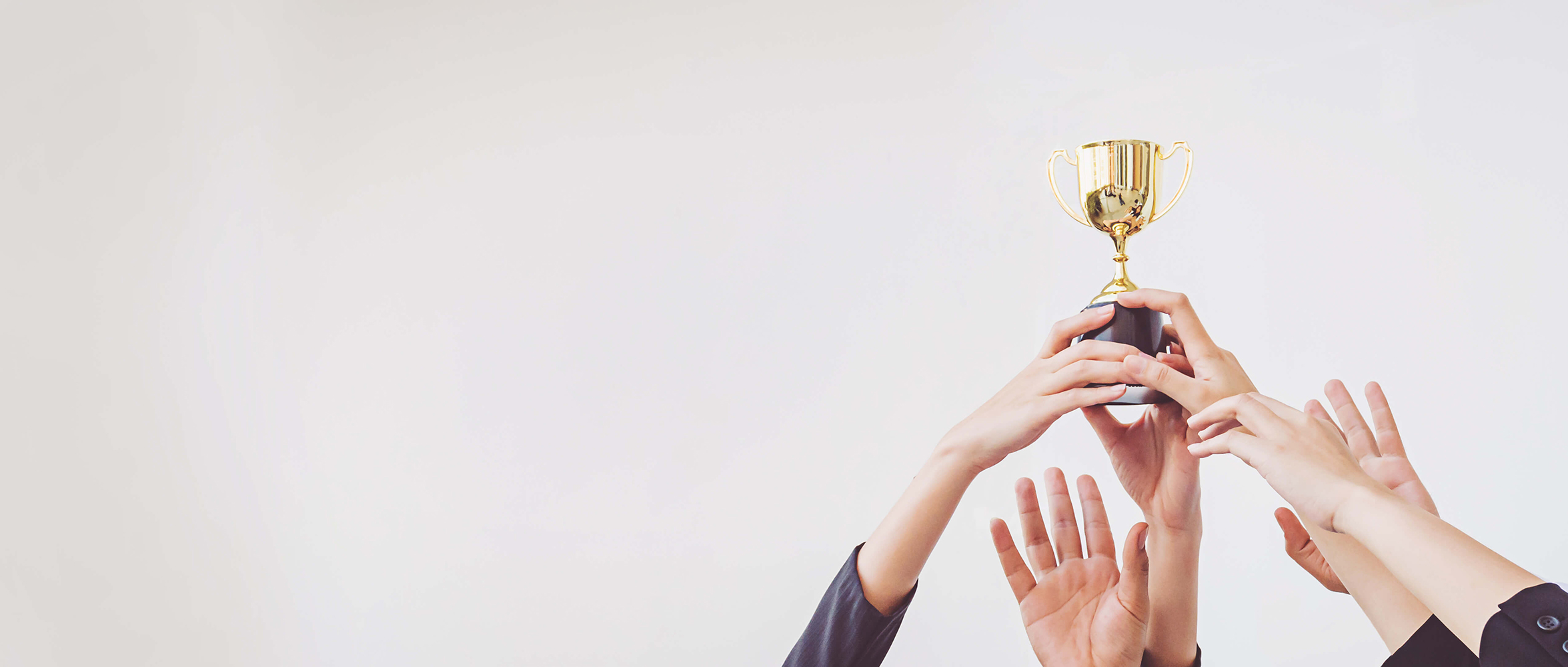 Hands scramble for golden trophy cup