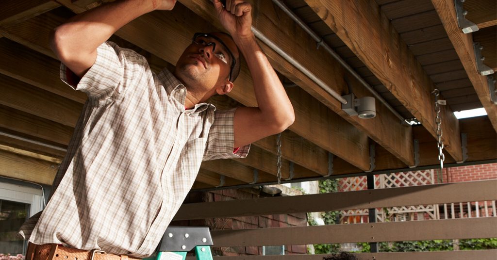 Man doing maintenance on deck