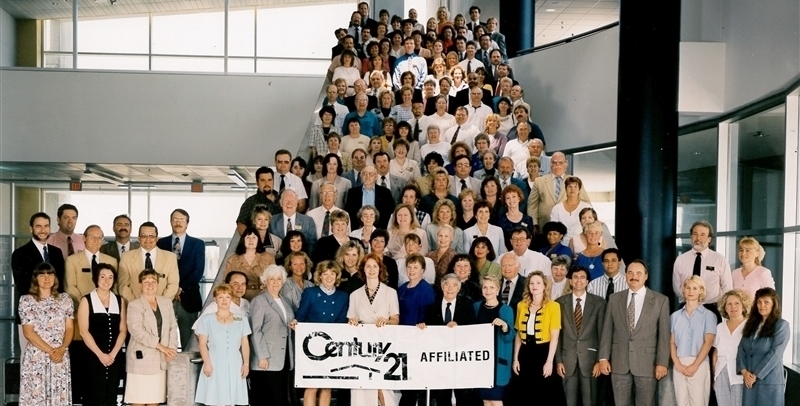 Group of CENTURY 21 Agents standing on the stairs