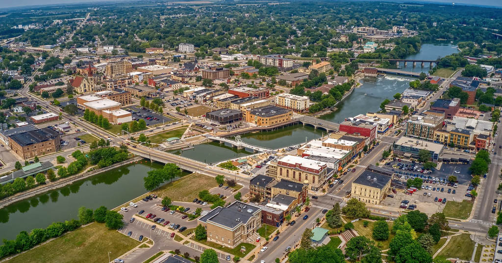 Downtown Janesville buildings and bridges beside the Rock River.