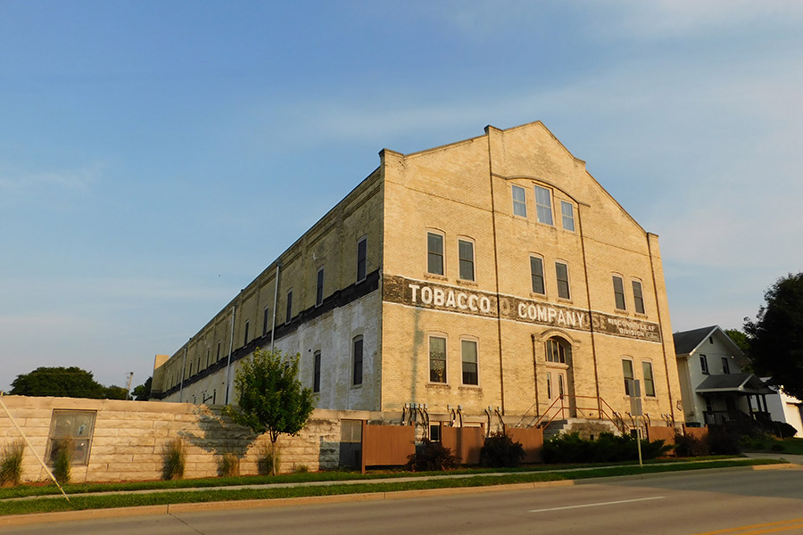 Historic tobacco warehouse from across an empty street in Edgerton Wisconsin.