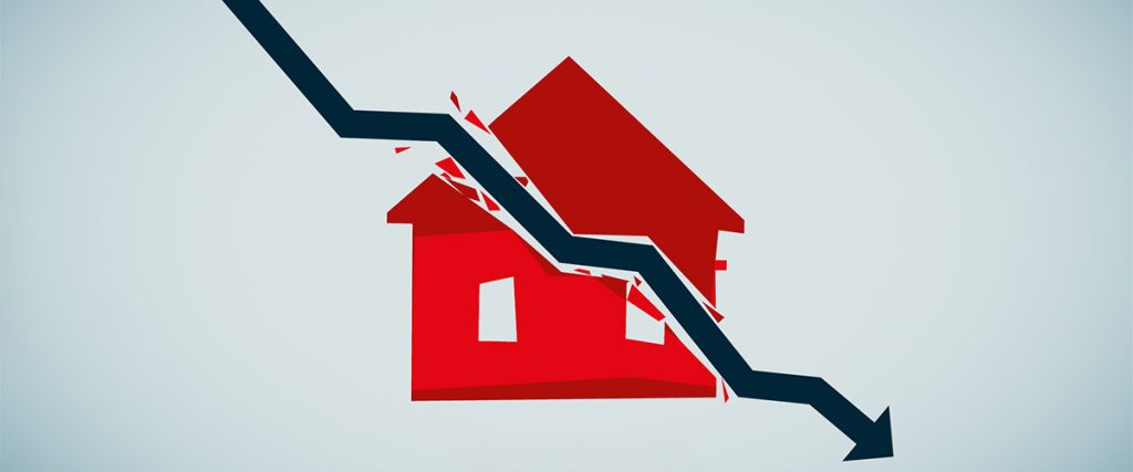 An icon of a red house divided by a blue arrow trending downward symbolizing how a recession in 2025 might affect the housing market.
