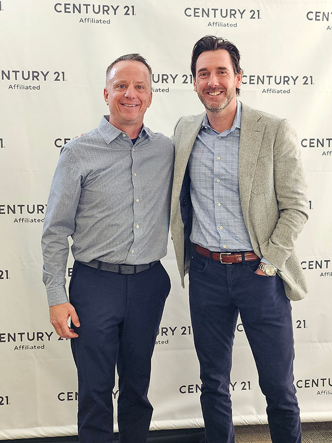 Century 21 Affiliated CEO Dan Kruse standing with Steve Meidam, the new Team Leader of the brokerage's Appleton Wisconsin office.