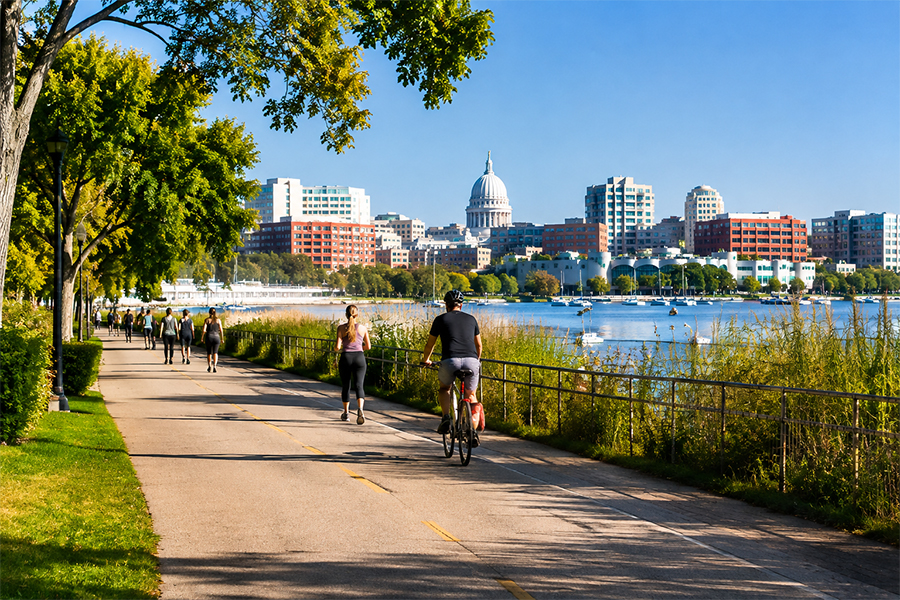 Madison, Wisconsin lakefront bike path with downtown skyline and Wisconsin State Capitol.