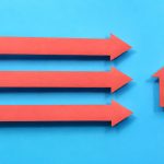 Three arrows point toward a house, representing a home sale moving forward and staying on track.