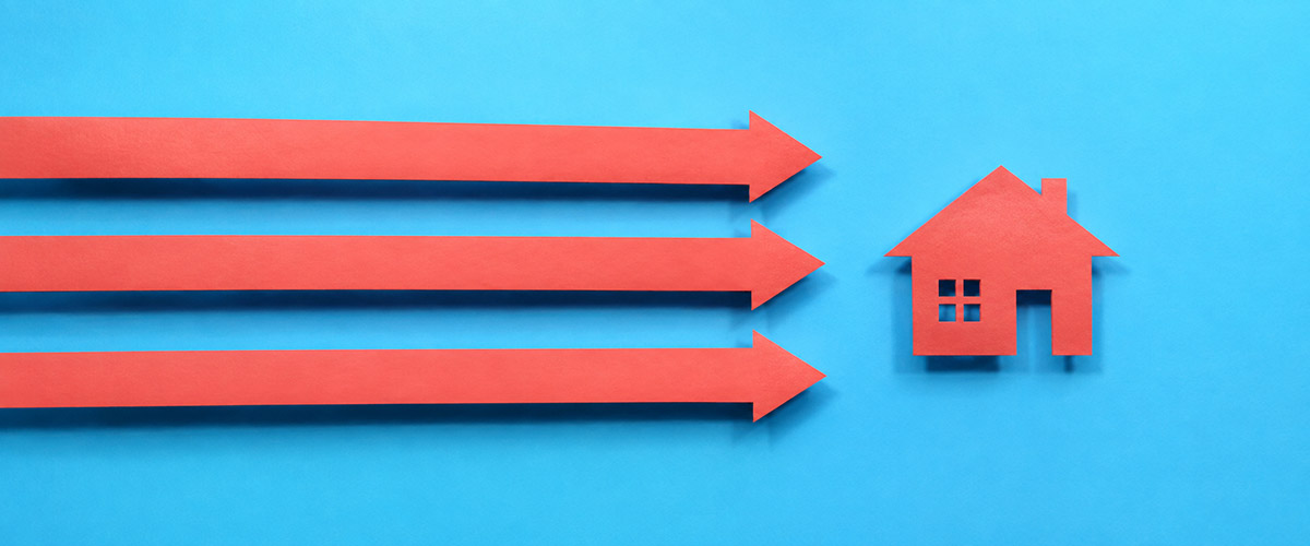Three arrows point toward a house, representing a home sale moving forward and staying on track.